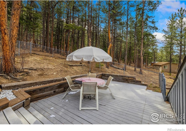 712 Aspen Dr, Lyons, CO 80540 - wooden terrace featuring fence and outdoor dining area