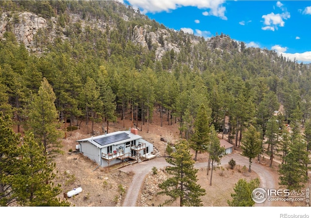 712 Aspen Dr, Lyons, CO 80540 - birds eye view of property with a forest view