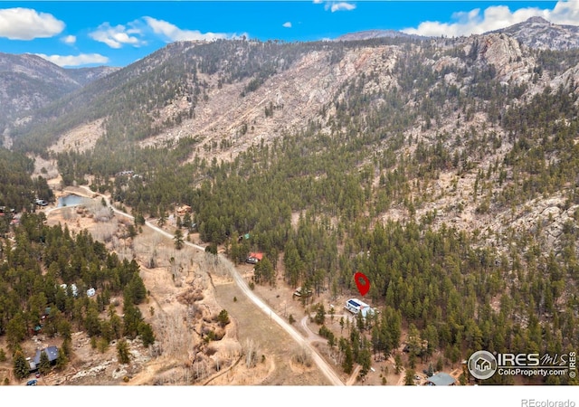 712 Aspen Dr, Lyons, CO 80540 - bird's eye view with a wooded view and a mountain view