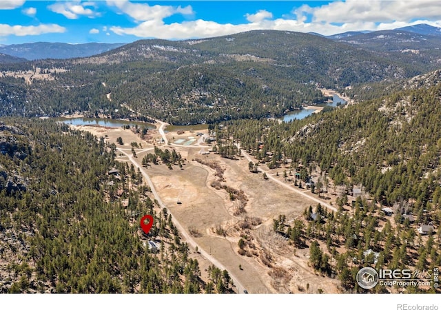 712 Aspen Dr, Lyons, CO 80540 - drone / aerial view featuring a view of trees and a water and mountain view