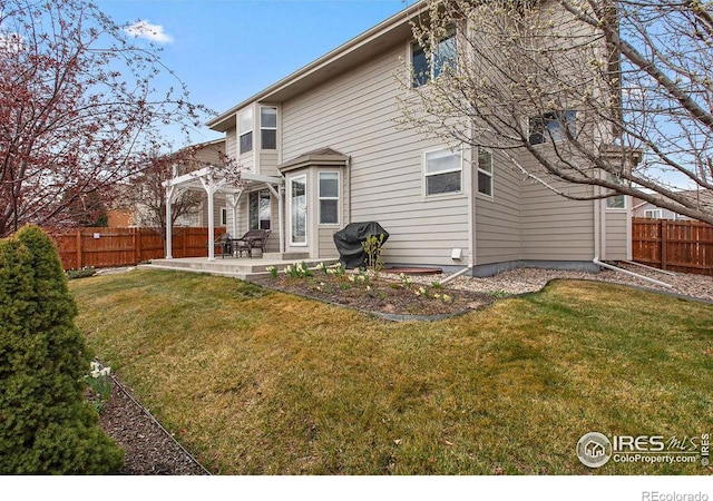 319 Gemstone Ln, Johnstown, CO 80534 - rear view of house featuring a pergola and a patio area