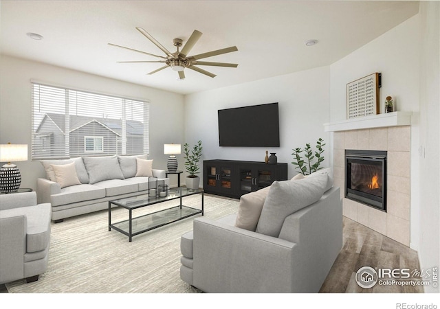 9283 Sedalia St, Commerce City, CO 80022 - living room featuring wood finished floors, ceiling fan, and a tile fireplace