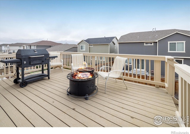 9283 Sedalia St, Commerce City, CO 80022 - deck with an outdoor fire pit and a residential view