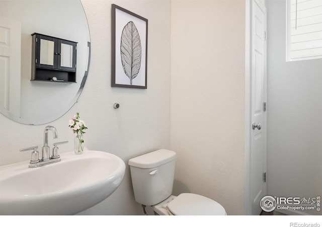 9283 Sedalia St, Commerce City, CO 80022 - half bath featuring a sink and toilet