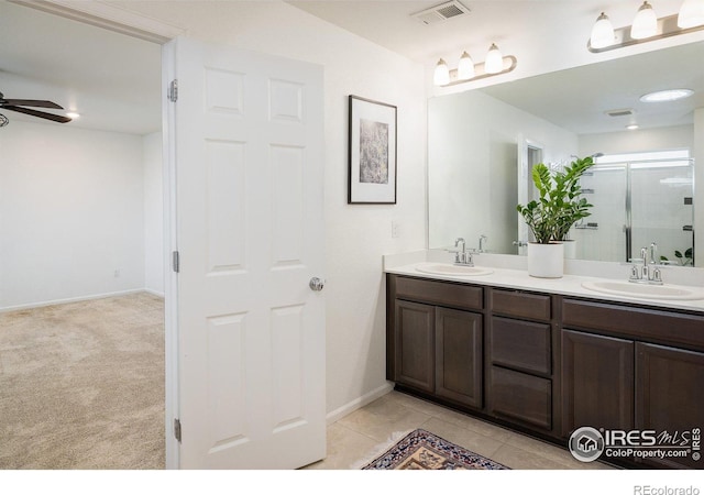 9283 Sedalia St, Commerce City, CO 80022 - bathroom featuring double vanity, ceiling fan, a sink, and visible vents
