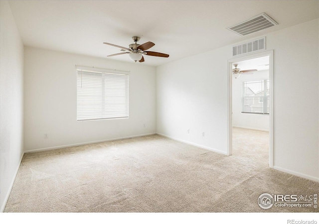9283 Sedalia St, Commerce City, CO 80022 - carpeted empty room with visible vents, baseboards, and a ceiling fan
