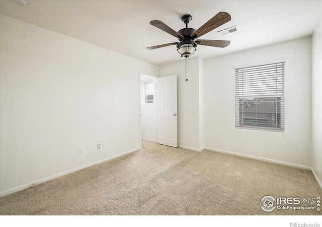 9283 Sedalia St, Commerce City, CO 80022 - unfurnished room with carpet, visible vents, baseboards, and a ceiling fan