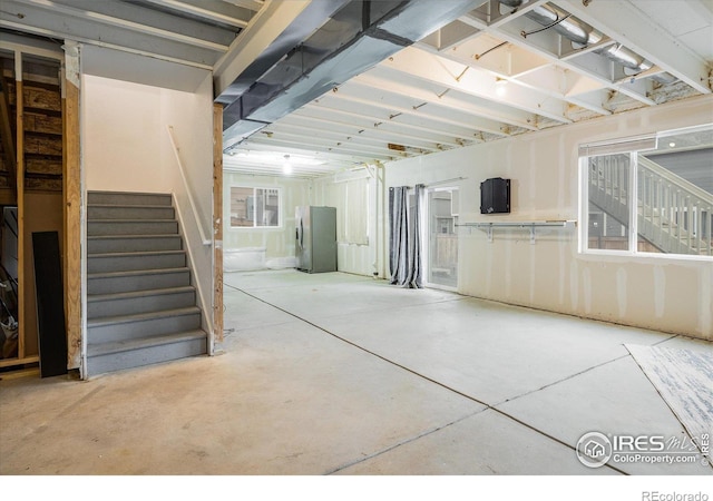 9283 Sedalia St, Commerce City, CO 80022 - unfinished below grade area with freestanding refrigerator and stairway