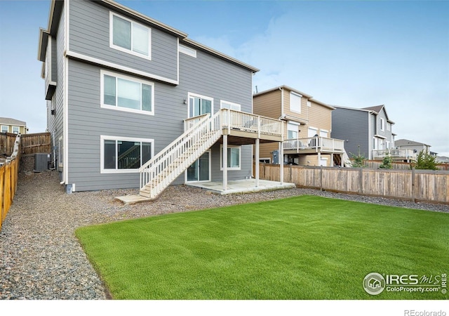 9283 Sedalia St, Commerce City, CO 80022 - back of house with cooling unit, a yard, a fenced backyard, a patio area, and a deck