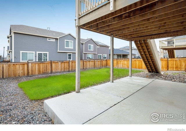9283 Sedalia St, Commerce City, CO 80022 - view of patio featuring a fenced backyard and stairway