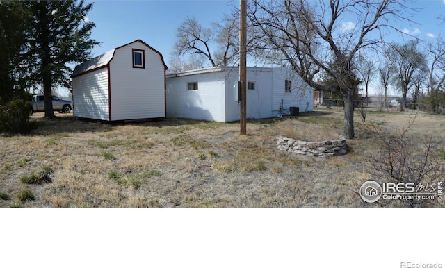 317 N Ord St, Grover, CO 80729 - view of yard with central AC unit and an outdoor structure