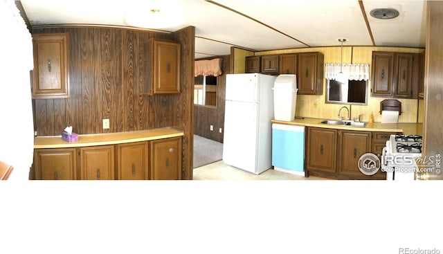 317 N Ord St, Grover, CO 80729 - kitchen with light countertops, dishwasher, freestanding refrigerator, stove, and a sink