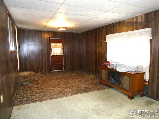 317 N Ord St, Grover, CO 80729 - carpeted foyer entrance with wooden walls and a drop ceiling