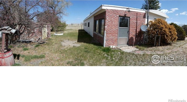 317 N Ord St, Grover, CO 80729 - view of side of property featuring brick siding