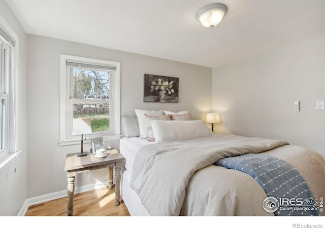 800 W 10th St, Loveland, CO 80537 - bedroom with wood finished floors and baseboards