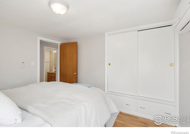 800 W 10th St, Loveland, CO 80537 - bedroom with a closet and light wood-style flooring