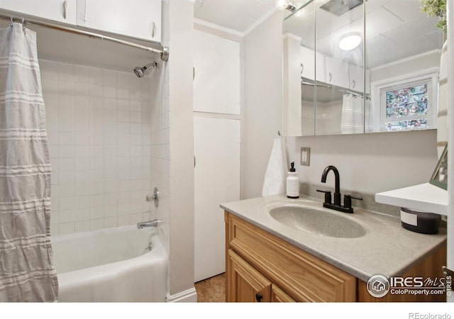 800 W 10th St, Loveland, CO 80537 - bathroom with vanity, shower / bath combo with shower curtain, and visible vents