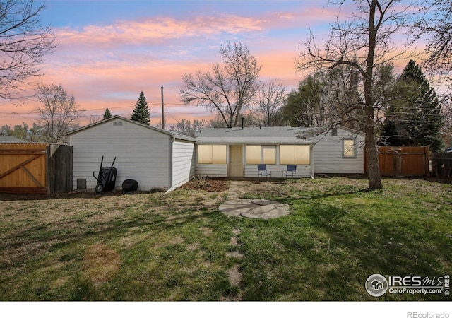 800 W 10th St, Loveland, CO 80537 - back of property with fence, a gate, and a lawn