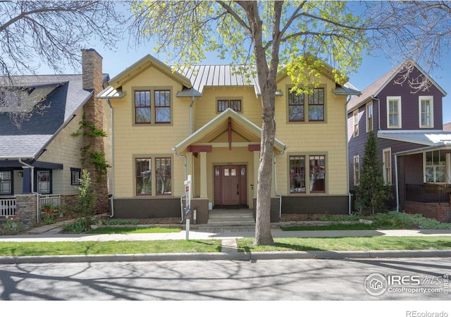 832 Neon Forest Cir, Longmont, CO 80504 - view of front facade featuring a chimney