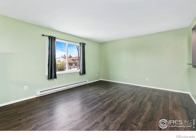 8205 Hallett Ct, Fort Collins, CO 80528 - unfurnished room featuring baseboard heating, dark wood-style flooring, and baseboards