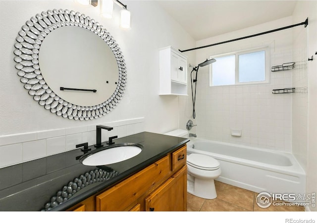 8205 Hallett Ct, Fort Collins, CO 80528 - bathroom with toilet, tile patterned floors, vanity, and shower / tub combination
