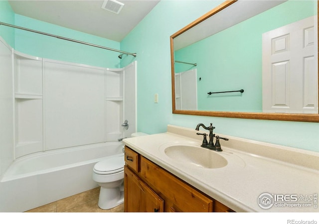 8205 Hallett Ct, Fort Collins, CO 80528 - bathroom with visible vents, toilet, bathtub / shower combination, vanity, and tile patterned floors