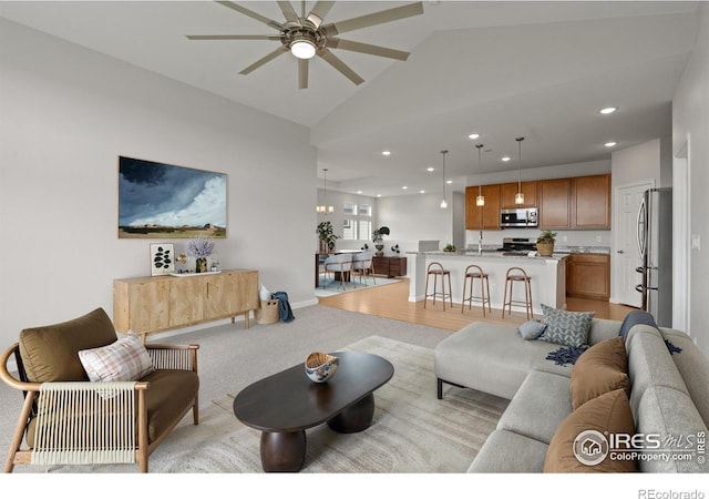 1103 Hornet Dr, Fort Collins, CO 80526 - living area featuring light carpet, recessed lighting, a ceiling fan, and lofted ceiling