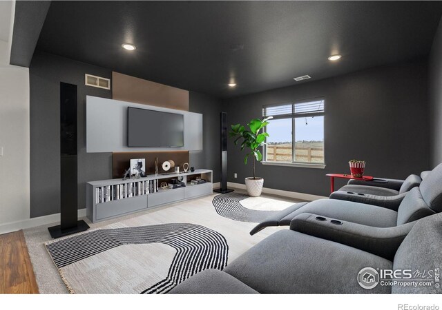 1103 Hornet Dr, Fort Collins, CO 80526 - living area featuring wood finished floors, baseboards, visible vents, and recessed lighting