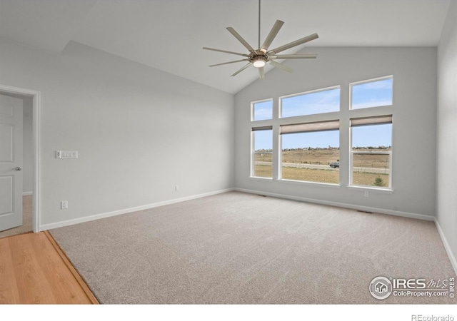 1103 Hornet Dr, Fort Collins, CO 80526 - empty room with high vaulted ceiling, carpet floors, baseboards, and ceiling fan