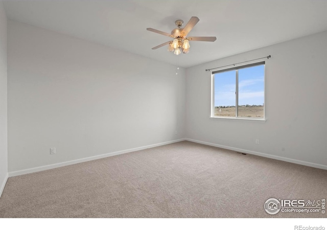 1103 Hornet Dr, Fort Collins, CO 80526 - spare room featuring ceiling fan, carpet flooring, and baseboards