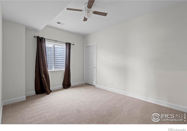 1103 Hornet Dr, Fort Collins, CO 80526 - spare room featuring visible vents, baseboards, a ceiling fan, and carpet