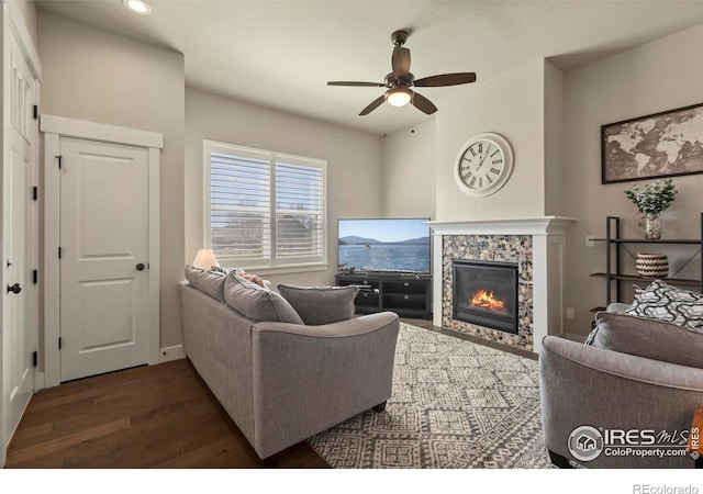 1708 W 50th St, Loveland, CO 80538 - living room with baseboards, a ceiling fan, a fireplace, recessed lighting, and wood finished floors