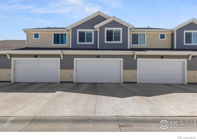 1708 W 50th St, Loveland, CO 80538 - townhome / multi-family property with a garage