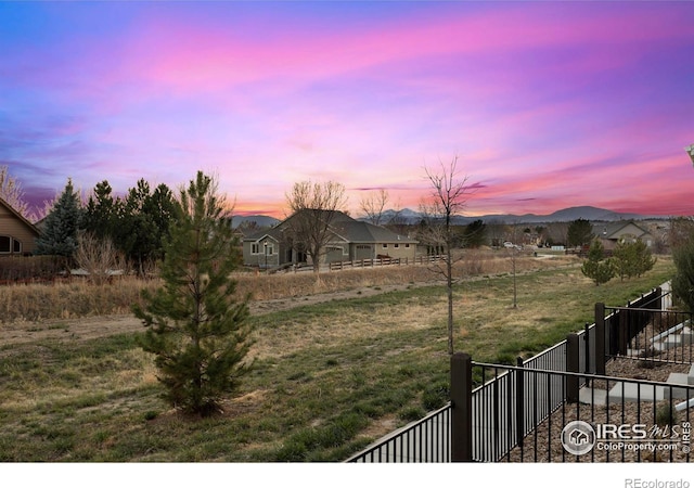 1708 W 50th St, Loveland, CO 80538 - view of yard featuring a mountain view and fence