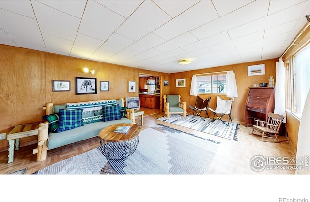 living room with wooden walls