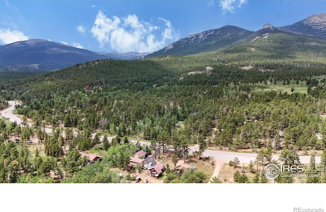 view of mountain background with a forest