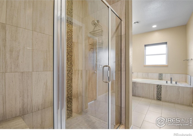 3620 Paonia St, Boulder, CO 80301 - bathroom featuring visible vents, tile patterned flooring, a stall shower, and a garden tub