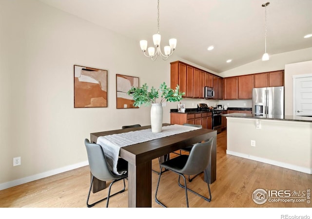 dining room with light wood-style floors, a notable chandelier, baseboards, and lofted ceiling
