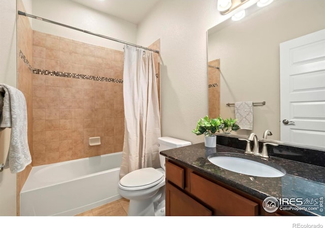 full bath featuring toilet, shower / bathtub combination with curtain, vanity, and tile patterned flooring