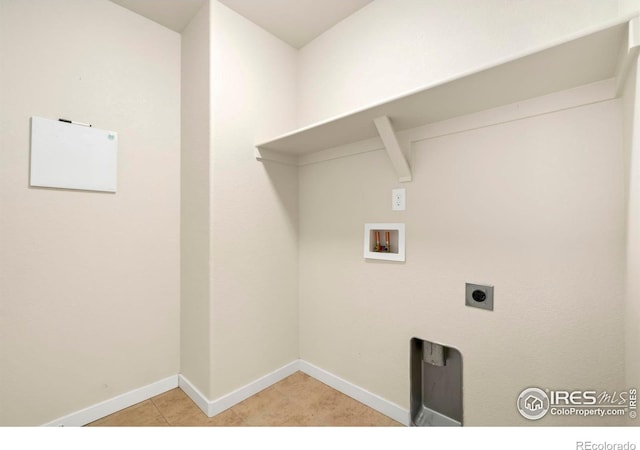 laundry room featuring hookup for an electric dryer, baseboards, light tile patterned flooring, laundry area, and hookup for a washing machine