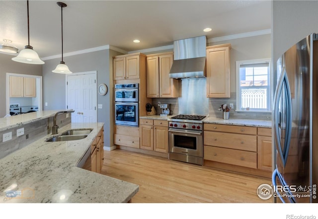 4921 Fountain St, Boulder, CO 80304 - kitchen with stainless steel appliances, light brown cabinetry, a sink, wall chimney exhaust hood, and crown molding