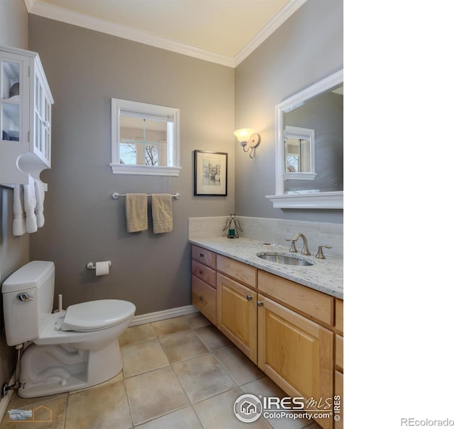 4921 Fountain St, Boulder, CO 80304 - bathroom with vanity, ornamental molding, toilet, baseboards, and tile patterned floors