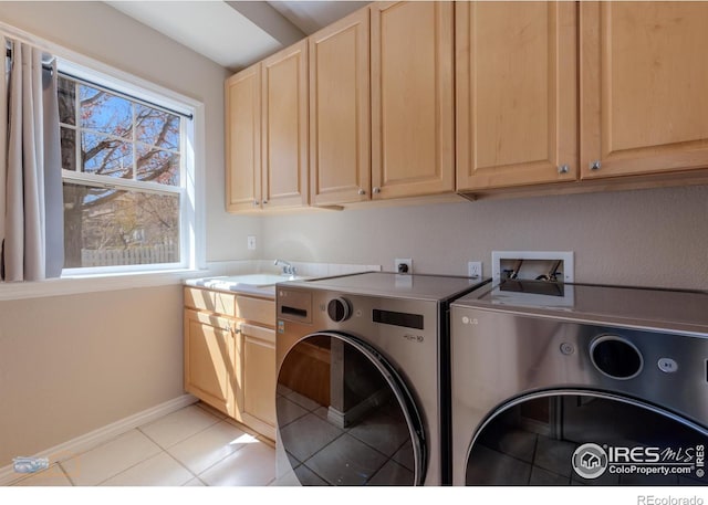 4921 Fountain St, Boulder, CO 80304 - washroom with washer and dryer, cabinet space, light tile patterned floors, and baseboards