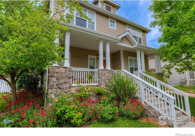 4921 Fountain St, Boulder, CO 80304 - american foursquare style home featuring a porch and stone siding