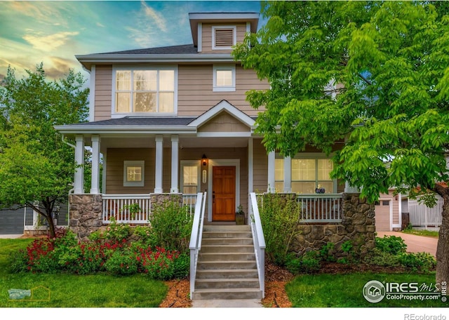 4921 Fountain St, Boulder, CO 80304 - american foursquare style home with a porch, stone siding, and concrete driveway