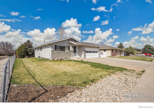 3735 W 8th St, Greeley, CO 80634 - ranch-style house with driveway, fence, a garage, and a front lawn