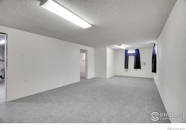 3735 W 8th St, Greeley, CO 80634 - unfurnished room featuring light carpet and a textured ceiling