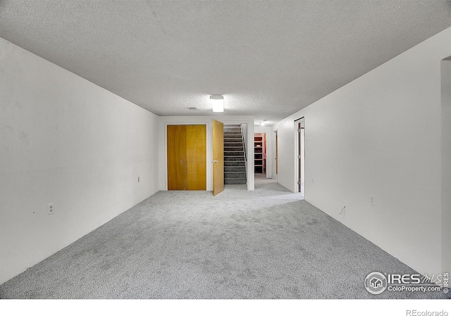 3735 W 8th St, Greeley, CO 80634 - unfurnished room with light colored carpet and a textured ceiling