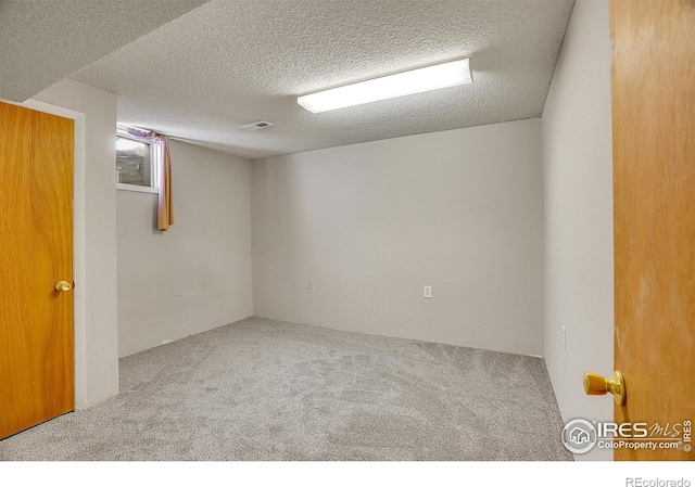 3735 W 8th St, Greeley, CO 80634 - carpeted spare room featuring visible vents and a textured ceiling