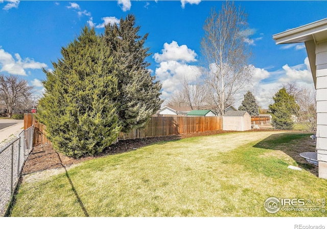 3735 W 8th St, Greeley, CO 80634 - view of yard with a fenced backyard and an outdoor structure